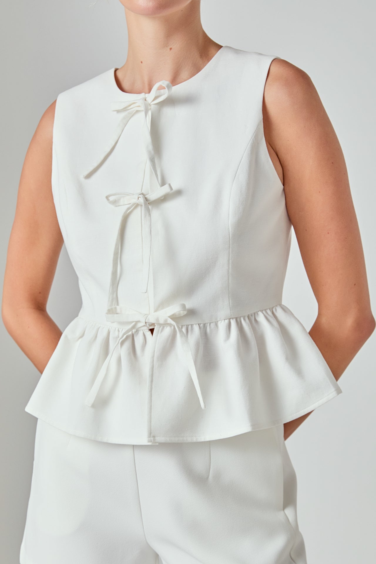Charlotte Sleeveless Peplum Top